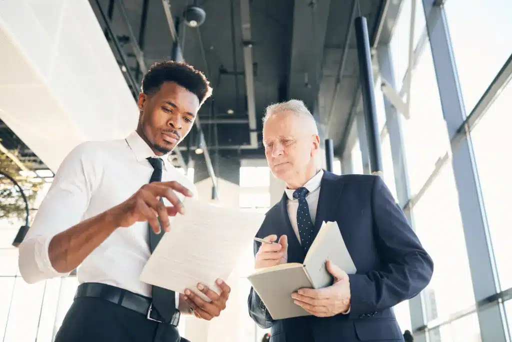 Small business owner reviewing Business Owners Policy endorsements and additional insurance coverage options with an insurance advisor