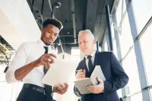 Small business owner reviewing Business Owners Policy endorsements and additional insurance coverage options with an insurance advisor